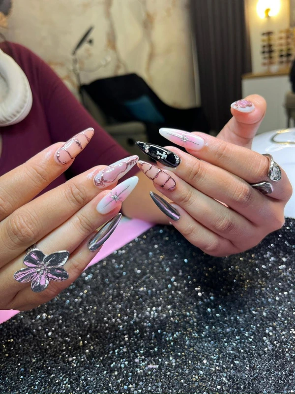 Long stiletto nails with butterfly nail art design